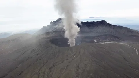 The aerial view of erupting Mt. Aso in Kagoshima, Japan, October 2019. Stock Footage 117280143
