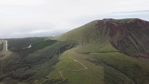 The aerial view of erupting Mt. Aso in Kagoshima, Japan, October 2019. Stock Footage 117280357