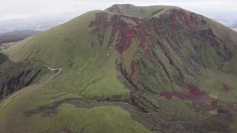 The aerial view of erupting Mt. Aso in Kagoshima, Japan, October 2019. Stock Footage 117280480
