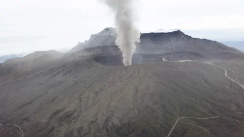 The aerial view of erupting Mt. Aso in Kagoshima, Japan, October 2019. Stock Footage 117280985