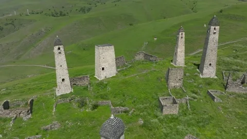 Aerial view of Erzi tower complex stone watchtowers in Ingushetia mountains Stock Footage 336295213