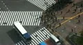 Aerial View Establishing Shot Tokyo Car Passing Crowded Urban Street People Walk HD Footage