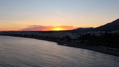 Aerial view of Estepona beach and town at sunset, Spain Stock Footage 343658879
