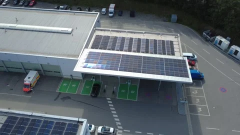 Aerial view of an EV charging station with a solar panel roof Stockbeeldmateriaal 344946514