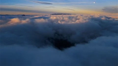 Aerial View of Evening Clouds with Pastel Sky over Foggy Mountains Landscape Stock Footage 309668178
