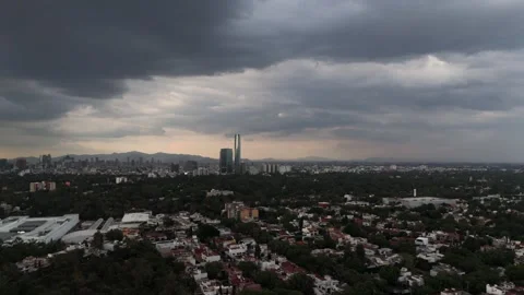 Aerial view of an evening storm developing over southern Mexico City 動画素材 311149562
