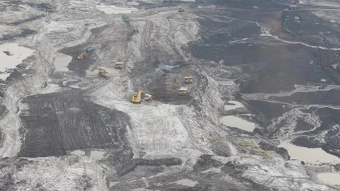 Aerial view of excavator digging and loading soil into truck for hauling ro.. Stock Footage 332600575