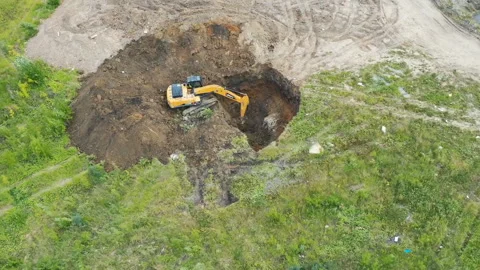Aerial view of the excavator digging a large pit, time lapse Stock Footage 111955407
