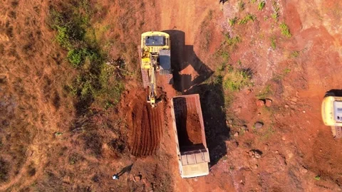Aerial view excavator loads soil in dump truck Stock Footage 297239290