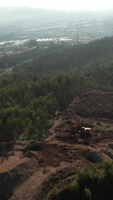 Aerial View of an excavator operating on a hillside Vertical Video 스톡 동영상 336327381