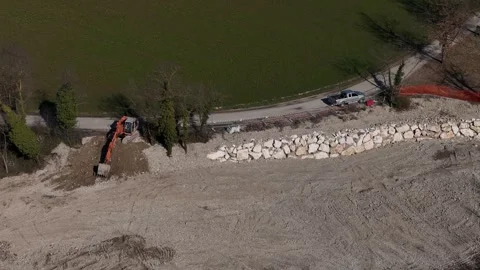 Aerial View of Excavator Working on Dry River Bed in Italy Vídeo Stock 336663009