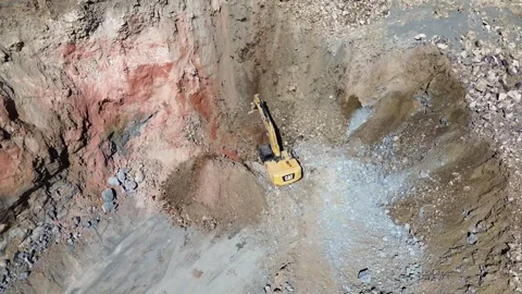 Aerial view of excavator working in open quarry pit Video stock 332722239