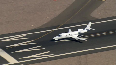 Aerial view of executive jet taxiing and taking off Stock Footage 59478242