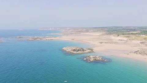 Aerial view of the expansive sandy beach and turquoise waters of Anse du Croc in Stock Footage 346702072