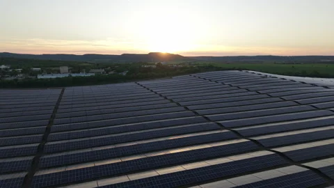 Aerial View of Expansive Solar Panel Farm at Sunset in Bulgaria Harnessing Clean Stock Footage 310365209