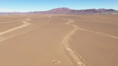 Aerial view exploring Atacama Desert ground, an infinite arid landscape Vídeo Stock 112598620