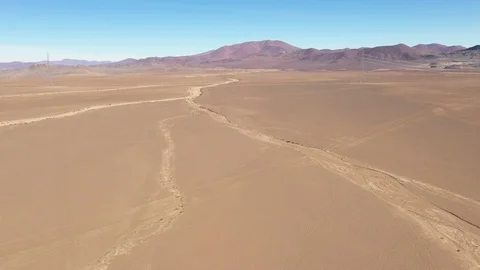 Aerial view exploring Atacama Desert ground, an infinite arid landscape Vídeo Stock 112602985