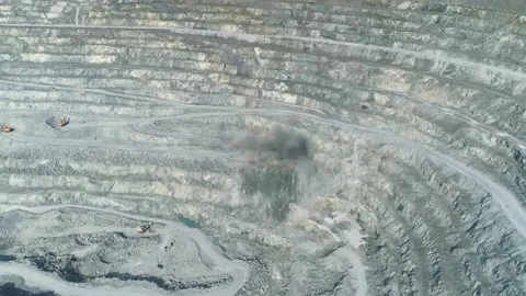 Aerial view of explosion in Huge asbestos quarry Stock Footage