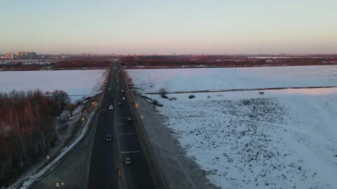 Aerial view of the expressway leading to the bridge over the river Stock Footage 171435547