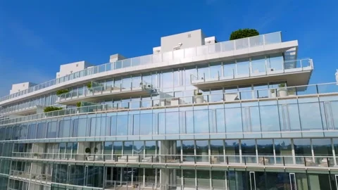 Aerial view of exquisite design of high-raised house with glass facade Stock Footage 245652943