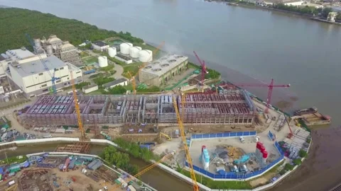 Aerial View of Extensive Construction Site Near Waterway Video stock 310990679