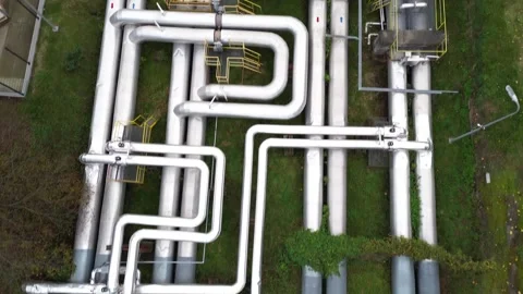 Aerial view of extensive piping system for heating and gas, showcasing intricate Stock Footage 318917737
