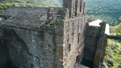 (Aerial view) Façade of the medieval monastery. Sant Quirze de Colera. Stock Footage 145721188