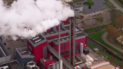 Aerial view of factory complex with tall chimney, Netherlands Stock Footage 313363364