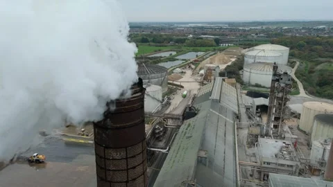 Aerial view of factory with smoke stack, United Kingdom. Stock Footage 320106400