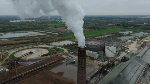 Aerial view of a factory with smoke stack, United Kingdom. Stock Footage 320106427
