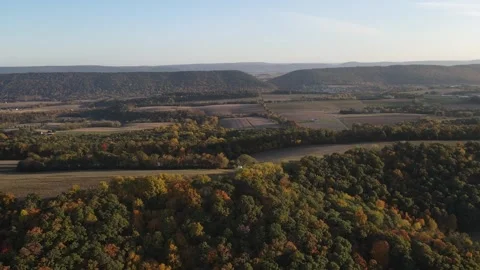 Aerial view of fall trees and corn fields in the mountains of in rural Cent.. Видео 243845080