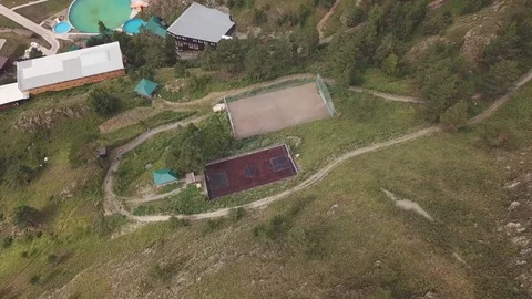 Aerial view of falling down to two sports fields for playing football and bas Stock Footage 96191058