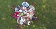  	Aerial View Of Family Having Summer Lunch In Yard Stock Footage