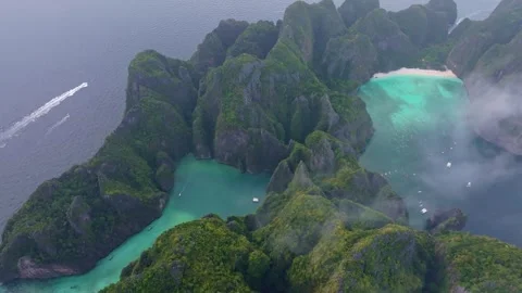 Aerial view of famous Phi Phi Lee island with beaches and lagoon Stock Footage 303358405