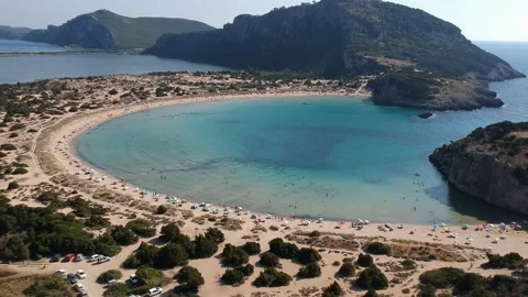 Aerial view of the famous semicircular sandy beach and lagoon of Voidokilia,  Stock Footage 202086230
