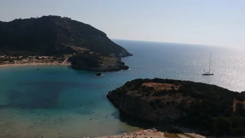 Aerial view of the famous semicircular sandy beach and lagoon of Voidokilia,  Stock Footage 202087997