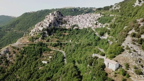 Aerial view from far of Cervara an Ancient medieval village perched on rock spur Stock Footage 92465501
