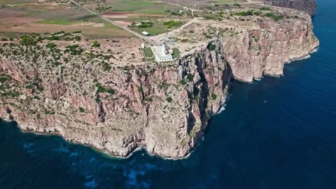 Aerial view of Far de la Mola Lighthouse on the rocky coastline of Formentera. Stock Footage 203835761