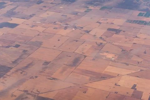 Aerial view of farm fields pattern. Agriculture landscape birds eye view Stock Photos