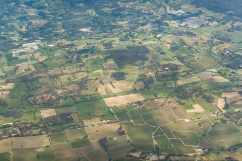Aerial view of farm fields pattern. Agriculture landscape view from above Stock Photos