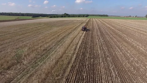 Aerial View Of A Farmer is Sowing Corn On A Huge Field Stock Footage 85290046