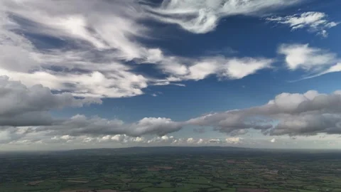 Aerial View of Farmland Beneath Dramatic Cloudy Sky Stockbeeldmateriaal 337852873