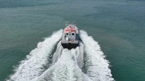 Aerial view of a fast boat speeding through the water Stock Footage 294067154