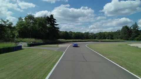 Aerial view of fast cars driving fast on the circuit Stockbeeldmateriaal 166310295