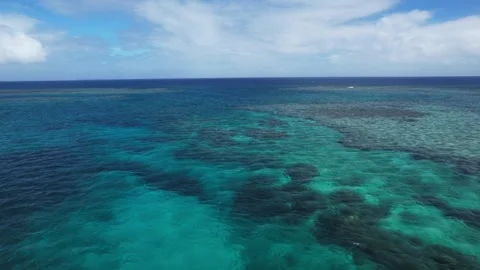 Aerial view Fast drone fly over crystal blue azure shallow water. Paradise Stock Footage 255539096