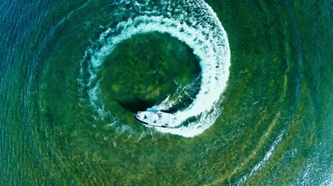 Aerial view of a fast fishing boat speeding in clean blue water Stock Footage 59025097