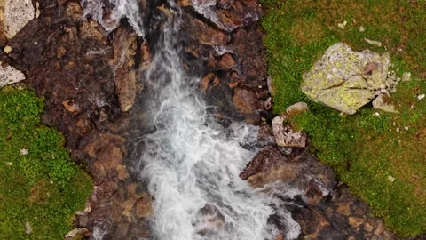 Aerial view of fast flowing mountain stream rapids Video stock 344420169