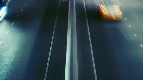Aerial view fast moving freeway traffic. Self driving autonomous cars Time Lapse Stock Footage 121100246