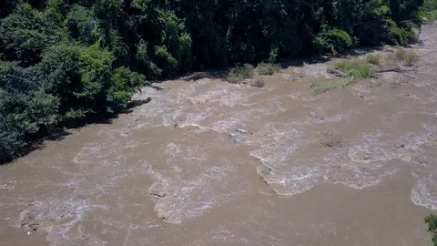 Aerial view of Fast Moving River with Rapids Surrounded by rain Forest. Shot in Stock Footage