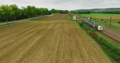 Aerial view of fast passenger train driving on railroad. High angle view of Видео 220158847